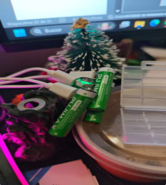 Customer charging USB-C batteries on a desk