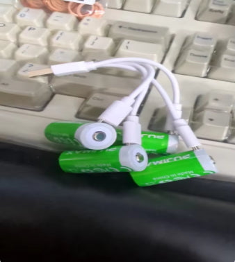 Customer CR123A batteries beside a keyboard